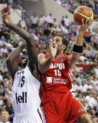 Canada (white) vs Lebanon (red). Day 1 of the 2010 FIBA World Championship in Izmyr. 28 August 2010. Preliminary round - Fadi El Khatib (R) vs Joel Anthony 