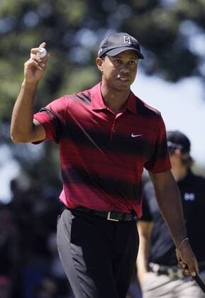 Tiger Woods (USA) reacts after a birdie putt on the ninth hole in the final round of The Barclays at Ridgewood Country Club in New Jersey on August 29, 2010.  NYP20100829105
