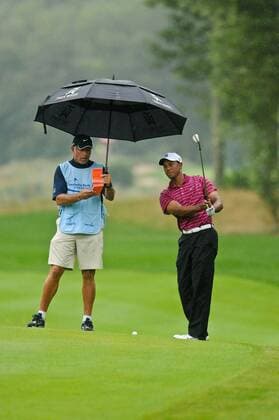 Sep. 03, 2010 - Norton, Massachusetts, United States of America - TIGER WOODS (USA, R) listens to his caddy Steve Williams (NZL) on the 7th hole fairway during the first round of the Deutsche Bank Championship at the TPC Boston. - ZUMAq39