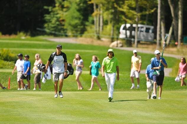 Sep. 05, 2010 - Norton, Massachusetts, United States of America - RICKIE FOWLER (USA, C) walks down the 7th hole fairway while the gallery crosses behind him during the third round of the Deutsche Bank Championship at TPC Boston. - ZUMAq39