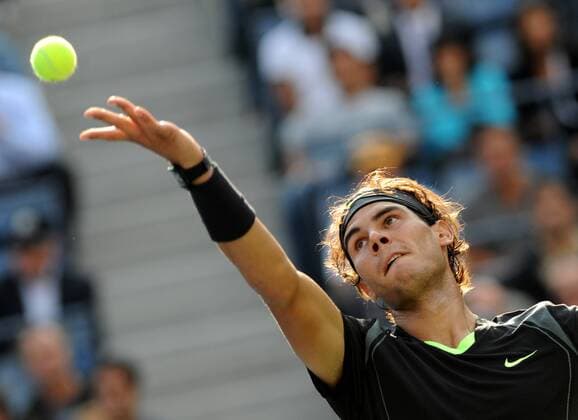 Rafael Nadal of Spain serves 