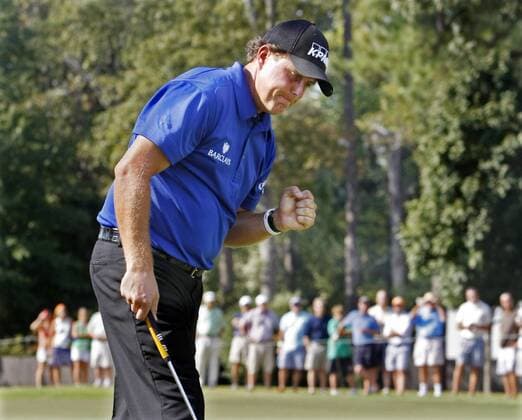 Sept. 23, 2010 - Atlanta, USA - 100923 Atlanta - EAGLE PUTT - Phil Mickelson USA pumps his fist as he sinks a eagle putt on the 15th green during the first round of The Tour Championship at East Lake Golf Club in Atlanta on Thursday, Sept. 23, 2010. Mickelson finished his round at 1-under par, 3 strokes off the lead. . - ZUMAaj1 Fed Ex Fedexcup