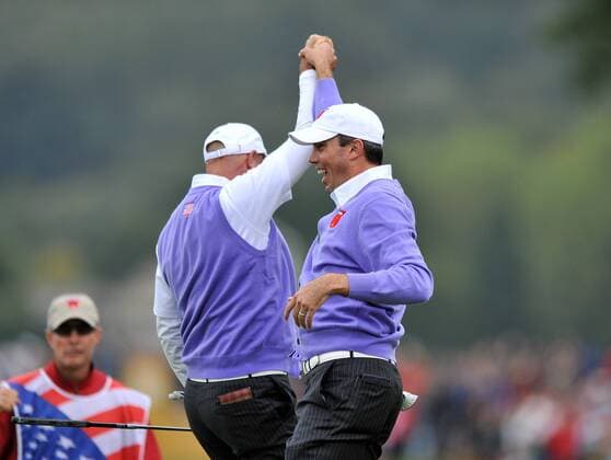 Golf - Ryder Cup 2010 - Day 2 Foursomes Stewart Cink (L) and Matt Kuchar (R) of the US celebrate winning the 17th hole to tie the match at Celtic Manor, Newport 