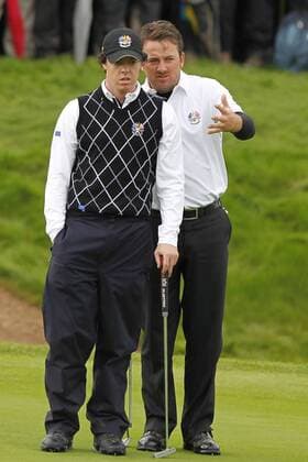 Golf - Ryder Cup 2010 - Day Three Rory McIlroy and Graeme McDowell (Northern Ireland Europe) plan their putt at Celtic Manor, Newport  o0 Mc Ilroy Mc Dowell Nordirland