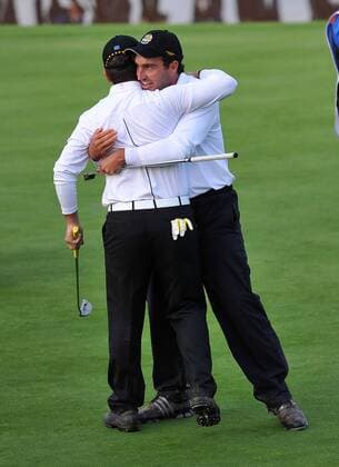 Golf - Ryder Cup 2010 - Day 3, 3rd Session Edoardo Molinari (L) hugs his brother Francesco (ITA Europe) after his birdie put to halve their match on the 18th hole at Celtic Manor, Newport  o0 Jubel, Freude