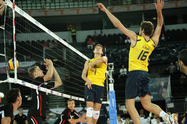 Rezende Bruno Mossa of Brazil lob while his team mate Saatkamp Lucas prepare to spike Brazil (yellow) vs. Germany (black) xMarcoxMegax  ActionPlus11101150 Content restricted for UK based newspaper