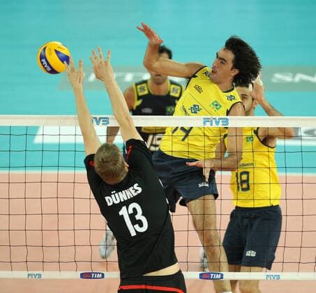 Santana Rodrigo of Brazil spikes over the German block by Dunnes Christian Brazil (yellow) vs. Germany (black) xMarcoxMegax  ActionPlus11101156 Content restricted for UK based newspaper