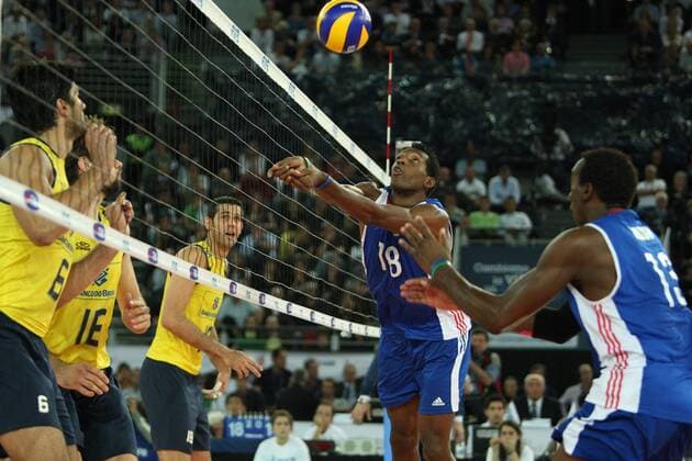 Diaz Carmenate Yoandry of Cuba jumps to get the ball Cuba (blue) vs. Brazil (yellow) FIVB Volleyball World Championship Final 2010 in Rome xMarcoxMegax  ActionPlus11103522