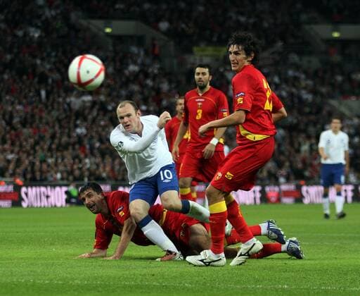 Englands Wayne Rooney (L) sees his shot saved European Championship Qualifying Group G England v Montenegro 12th October, 2010 EDITORIAL USE ONLY. No use with unauthorised audio, video, data, fixture lists, club league logos or live services. Online in-match use limited to 120 images, no video emulation. No use in betting, games or single club league player publications.