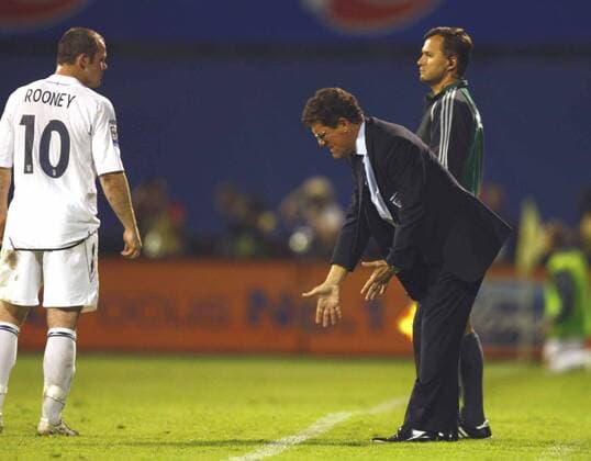 Fabio Capello ( England Coach, R) having words with Wayne Rooney (England) - Croatia v England at Maksimir Stadium Zagreb - 