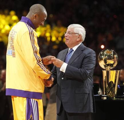 Los Angeles Lakers Kobe Bryant gets his championship ring from NBA Commission David Stern before their NBA basketball game against the Houston Rockets in Los Angeles on October 26, 2010. The Lakers won 112 to 110.  LAP20101026815