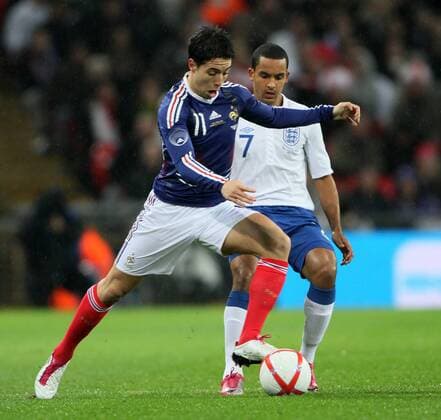 Englands Theo Walcott tussles with Frances Samir Nasri International Friendly England (white) v France (blue) 17th November, 2010 EDITORIAL USE ONLY. No use with unauthorised audio, video, data, fixture lists, club league logos or live services. Online in-match use limited to 120 images, no video emulation. No use in betting, games or single club league player publications.