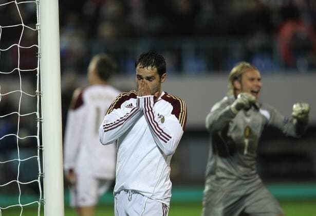 National team of Russia (white) held friendly match against Belgium (red) in Voronezh: .47 Roman Shirokov (L) and and goalkeeper Jean Francois Gillet (BEL). 