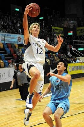 HONG KONG, Dec. 14, 2010 - Philippines Long Jeffrey Kirk (L) shoots during the match against Thailand at the 18th Kung Sheung Cup International Basketball Invitation Championship in HongKong -