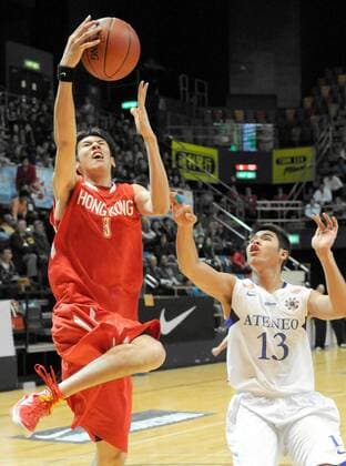 HONG KONG HONGKONG, Dec. 19, 2010 -- Lau Hoi To (L) of Hong Kong basketball team shoots during the match against the Philippines at the 18th Kung Sheung Cup International Basketball Invitation Championship in Hong Kong, Dec. 19, 2010. Hong Kong of China won 61-45. --- 
