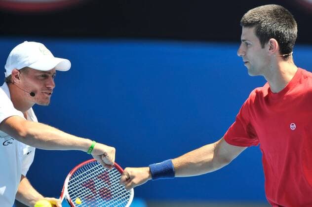 Jan. 16, 2011 - Melbourne, Victoria, Australia - Lleyton Hewitt l. Australia and Novak Djokovic SRB react after winning a point at the Rally For Relief charity exhibition match by top players of the 2011 Australian Open at Melbourne Park. - ZUMAx35
