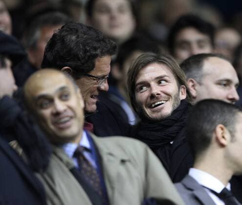 David Beckham (England Los Angeles Galaxy, R) is greeted by England coach Fabio Capello - Barclays Premier League Tottenham Hotspur v Manchester United 16th January, 2011 EDITORIAL USE ONLY. No use with unauthorised audio, video, data, fixture lists, club league logos or live services. Online in-match use limited to 120 images, no video emulation. No use in betting, games or single club league player publications.