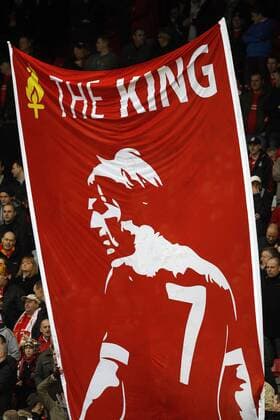 Liverpool fans wave a Kenny Dalglish flag before kick off - FC Liverpool - EDITORIAL USE ONLY. No use with unauthorised audio, video, data, fixture lists, club league logos or live services. Online in-match use limited to 120 images, no video emulation. No use in betting, games or single club league player publications.