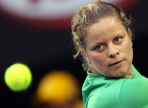 Melbourne - Kim Clijsters of Belgium returns during the first round women s single match at the Australian Open tennis tournament in Melbourne, 