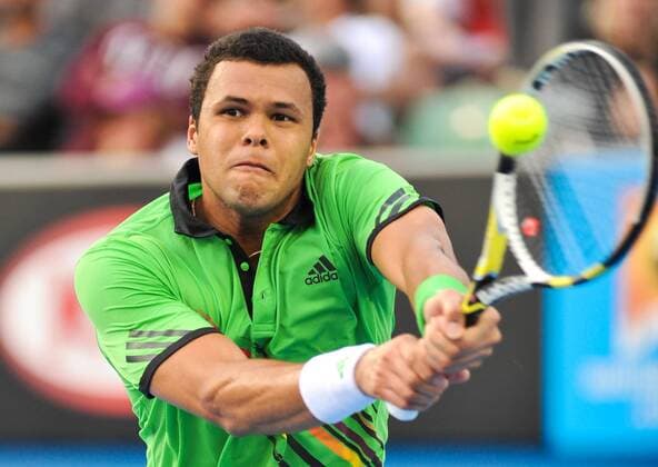 Melbourne - Jo-Wilfried Tsonga of France returns during the first round men s single match at the Australian Open tennis tournament in Melbourne, 