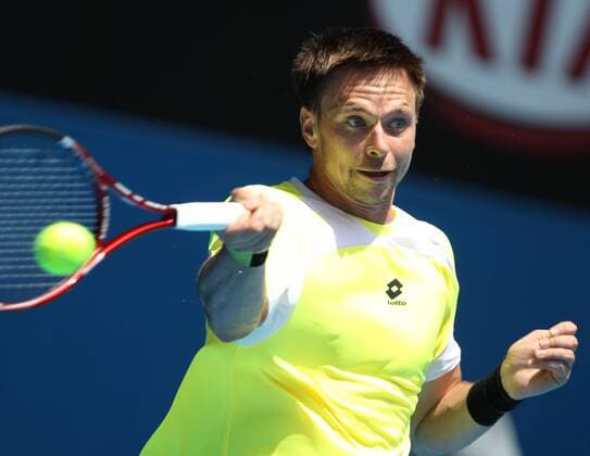 Robin Soderling of Sweden returns the ball during the third round match in Melbourne 