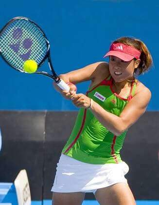 Ayumi Morita of Japan returns the ball during the third round match of women s singles at the Australian Open tennis tournament in Melbourne Jan. 22, 2011. Peng Shuai won 2-1 and advanced to the quarterfinal. 