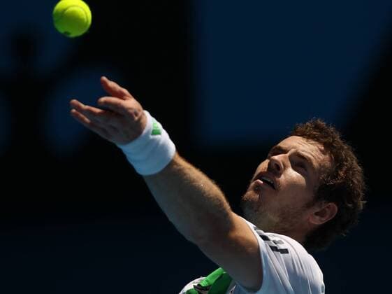 Andy Murray of Britain serves during the third round match of men s singles at the Australian Open tennis tournament in Melbourne Jan. 22, 2011. Murray won 3-0.  o0 Andrew Gegenlicht Restlichtaufnahme