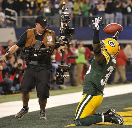 Green Bay Packers safety Nick Collins celebrates his 37-yard interception returned for a touchdown against the Pittsburgh Steelers in the first quarter during Super Bowl XLV at Cowboys Stadium in Arlington, Texas on February 6, 2011.  SBP20110206553