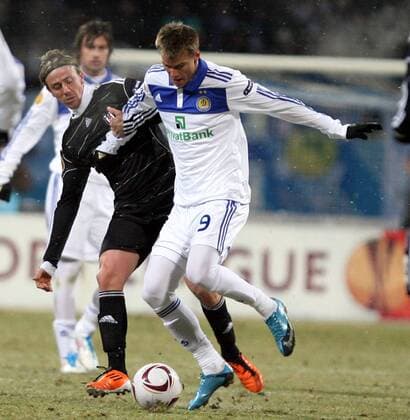 Euroleague soccer match between Dynamo Kyiv (white) and Besiktas Istanbul ( black ) and at Valeriy Lobanovsky Stadium in Kyiv, Ukraine on February 24, 2011. Match Scored: Dynamo Kyiv 4 - Besiktas 0 Pictured: Andriy Yarmolenko of Dynamo Kyiv and Guti of Besiktas. 