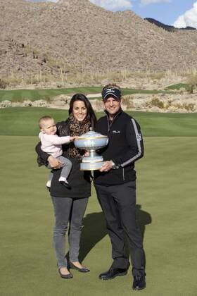 Marana, Arizona - LUKE DONALD (England) and his wife, DIANE, and their daughter ELLE hold the winners trouphy after DONALD won the Accenture Match Play Championship Match in Marana - - ZUMAhk1