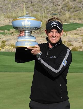 Luke Donald of England holds the trophy for winning the WGC-Accenture Match Play Championship at Dove Mountain Golf Course in Marana, AZ -  PXP2011022713