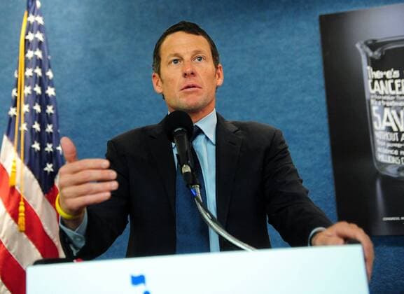 Lance Armstrong (USA) delivers remarks at a press conference held to urge Congress to oppose cuts to cancer research and prevention programs, in Washington on March 24, 2011.  WAP20110324312