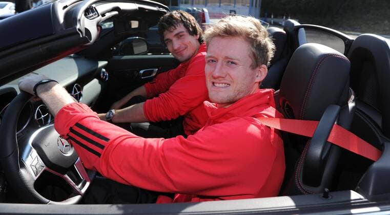 Andre SCHUERRLE (DFB Deutschland) r. und Mats HUMMELS (DFB Deutschland) l. sitzen am Steuer. Fussball: Driving-Experience Fahrsicherheitstraining der deutschen Fussball Nationalmannschaft der Männer auf der Strecke des ADAC-Fahrsicherheitszentrum in Grevenbroich, 28.03.2011. Poolfoto.