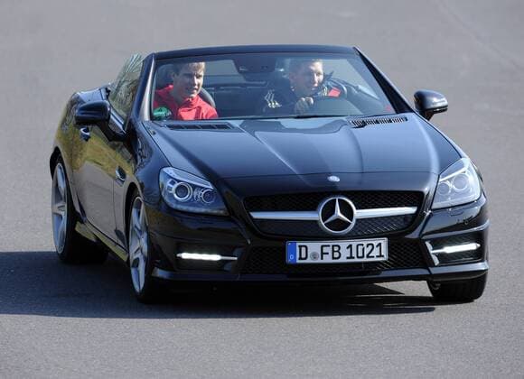 Am Steuer des Mercedes-Benz SLK 350 BlueEFFICIENCY: Andre SCHUERRLE (DFB Deutschland). Fussball: Driving-Experience Fahrsicherheitstraining der deutschen Fussball Nationalmannschaft der Männer auf der Strecke des ADAC-Fahrsicherheitszentrum in Grevenbroich, 28.03.2011. Poolfoto.