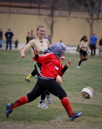 Players of both team fight for the ball during a friendly match between Afghan women s national soccer team and NATO-led International Security Aid Force women s soccer team in Kabul, capital of Afghanistan, on April 1, 2011. The match ended with a 0-0 tie.  o0 Aktion Kopftuch Islam Muslimin