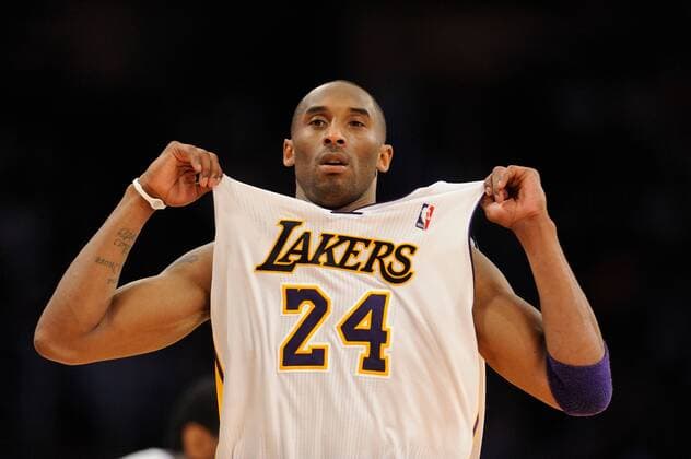 April 3, 2011: Los Angeles Lakers Kobe Bryant pulls on his jersey during a game against the Denver Nuggets during a game 95-90 Nuggets win on Sunday at Staples Center in Los Angeles, CA. Icon110403071 EDITORIAL USE ONLY