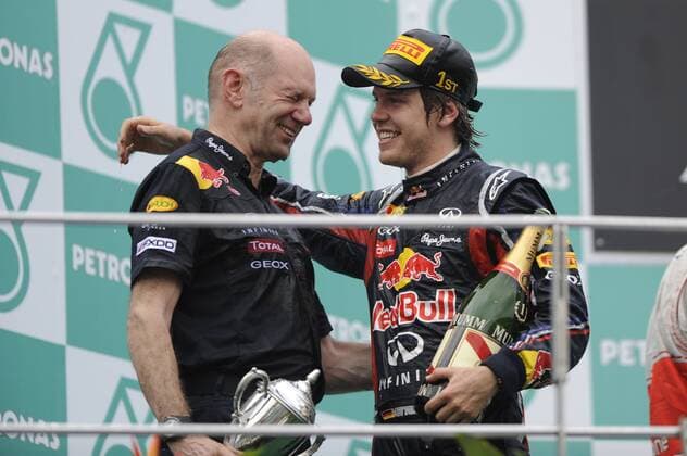 Sebastian VETTEL (GER),Red Bull Racing mit Chefdesigner Adrian NEWEY (GBR),Aktion,Einzelbild,angeschnittenes Einzelmotiv,Halbfigur,halbe Figur. Jubel,Freude,Begeisterung,Gestik,Siegerehrung. Rennen,Formel 1:GP von Malaysia Sepang Circuit Kuala Lumpur,Saison2011,
