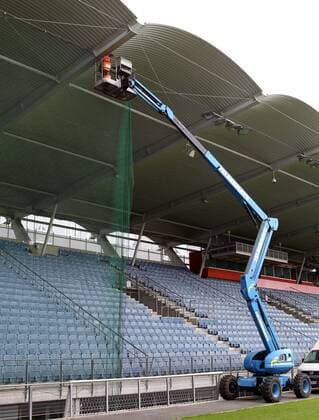 GRAZ,AUSTRIA,12.APR.11 - FUSSBALL - SK Sturm Graz, Installation: Sicherheitsnetz in der UPC Arena. Bild zeigt die Montagearbeiten. Keyword: Kran.  o0 Stadionsicherheit Security Fangnetz