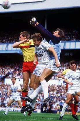 Ray Clemence (Spurs) goalkeeper punches clear from Mark Falco and John McClelland (Watford) 17 08 1985; Tottenham Hotspur v Watford Football 