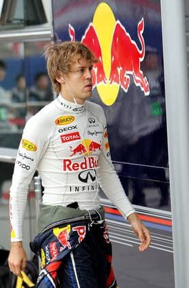 SHANGHAI, April 16, 2011 -- Red Bull Formula One driver Sebastian Vettel of Germany walks before the qualifying session of the Chinese F1 Grand Prix at Shanghai International circuit in Shanghai, east China, April 16, 2011. ---  o0 Logo Teamlogo Werbebande Bande Werbung Werbepartner Sponsor Wirtschaft RB RedBull