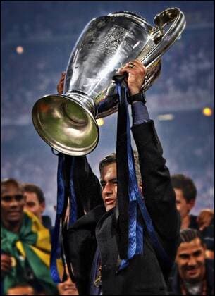 Football - Champions League Final - Inter Milan s Jose Mourinho holds aloft the Champions League Trophy. 