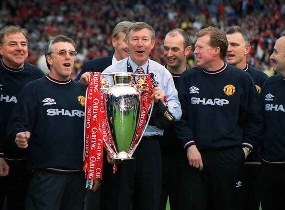 Manchester United - English Premiership Winner 1999 - Coach Alex Ferguson (ManU, C) Celebrates the Carling Premiership Trophy with his Backroom staff including assistant Coach Steve McClaren (right). 