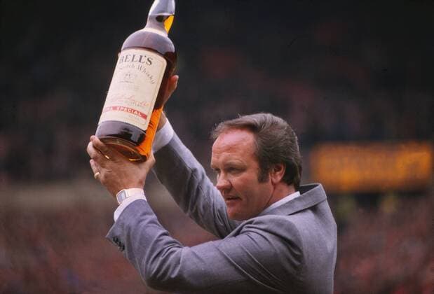 Manchester United v Everton FC, FA Cup 6th Round, 12 03 1983 - Coach Ron Atkinson (ManU) with his Coach of the month bottle of Bells Whisky 