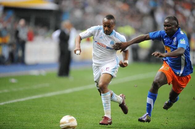 Finale des Coupe de la Ligue - Olympique Marseille (weiß) vs. Montpellier HSC (blau) --- Mapou Yangambiwa (Montpellier) und Andre Ayew (Marseille)  NLeGouicFEP o0 Dede o0 Yanga Mbiwa