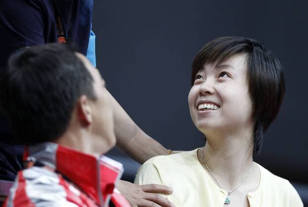 ROTTERDAM, May 12, 2011 - Olympic champion Zhang Yining (R) of China talks with friends in the World Table Tennis Championships (WTTC) at Ahoy Arena in Rotterdam, May 12, 2011. 