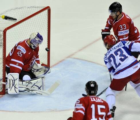 IIHF World Championship Slovakia 2011, Bratislava, May 12, 2011, quarterfinal, Canada vs. Russia. Left to right: Jonathan Bernier (CAN), Travis Zajac (CAN), Alexej Teresenko (RUS) and Marc Methot (CAN). (CTKxPhoto JanxKoller)  CTKPhoto7201105121195101