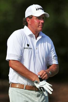 Phil Mickelson puts on his glove as he walks to the 15th tee box preparing to hit a drive during the first round of The Players Championship Thursday May 12, 2011 on the Stadium Course at TPC Sawgrass in Ponte Vedra Beach, Florida. UPI Photo Rick Wilson  JAX2011051222