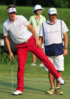 Ian Poulter balances on his right leg as he looks over his putting line on the 8th green during the first round of The Players Championship Thursday May 12, 2011 on the Stadium Course at TPC Sawgrass in Ponte Vedra Beach, Florida. Poulter made the birdie putt. UPI Photo Rick Wilson  JAX2011051223