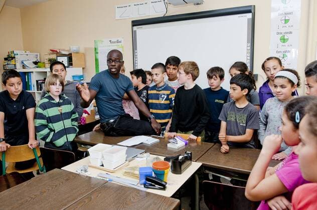 Brussels, Belgium May 25, 2011 Lilian Thuram supports an action against racism with local schoolchildren 