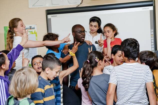 Brussels, Belgium May 25, 2011 Lilian Thuram supports an action against racism with local schoolchildren 